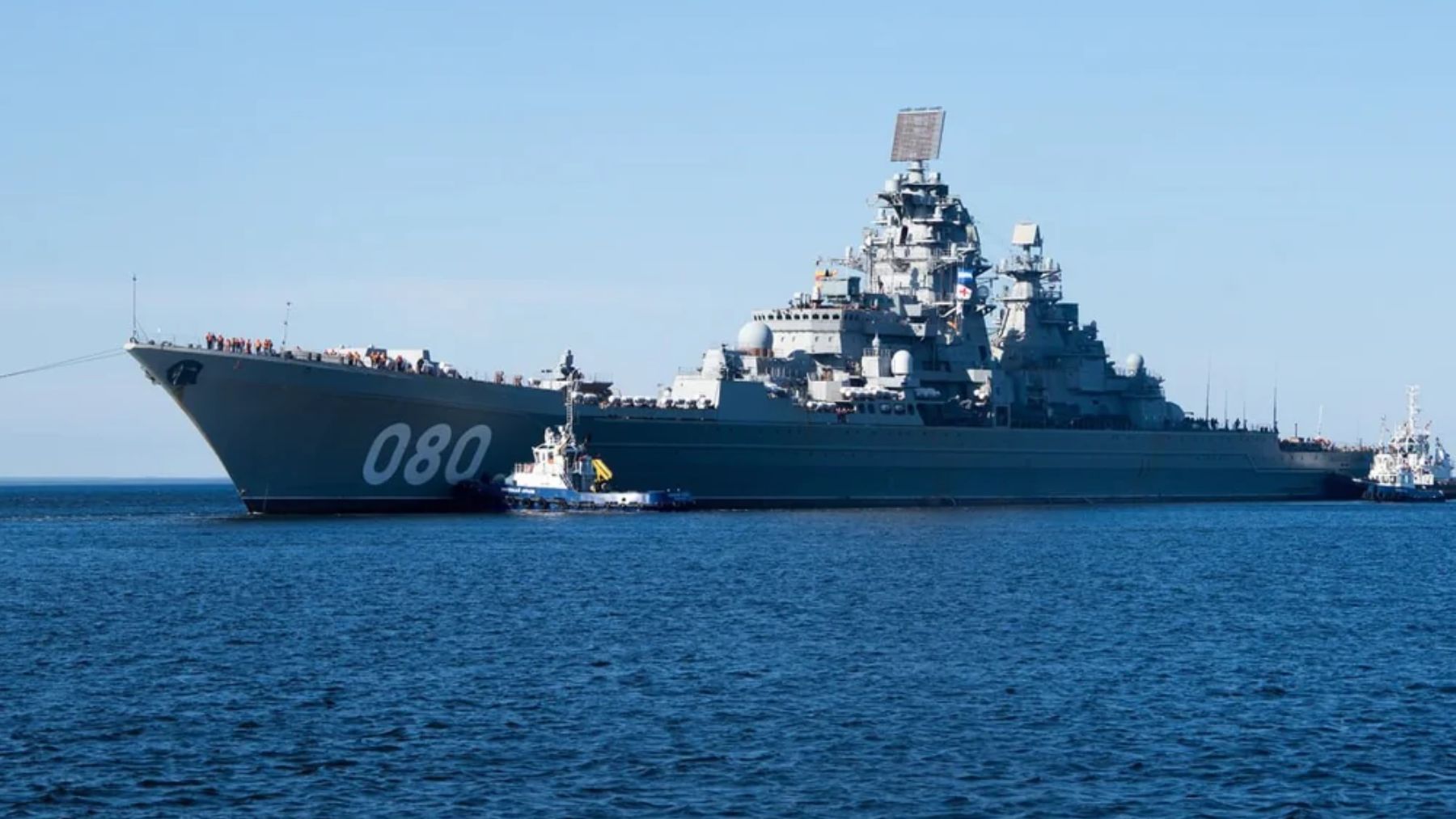 Russian Navy nuclear-powered cruiser Admiral Nakhimov (080) at sea with escort tugs