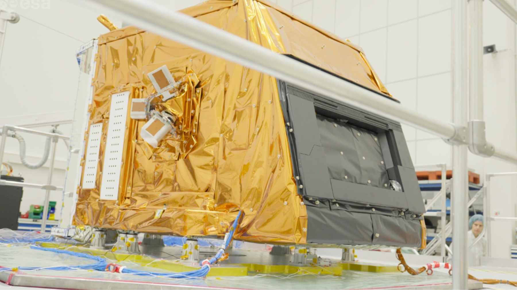 CHIME hyperspectral satellite instrument test unit wrapped in gold thermal insulation inside a cleanroom for Copernicus missions.