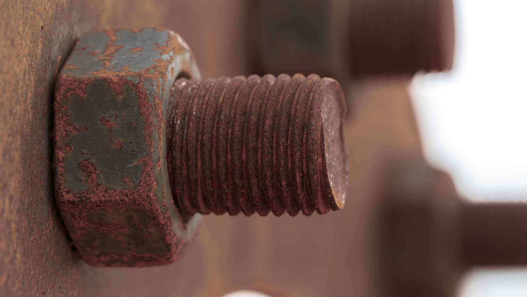 Close-up of a rusted suspension bolt, illustrating corrosion risk behind the Toyota Proace recall.